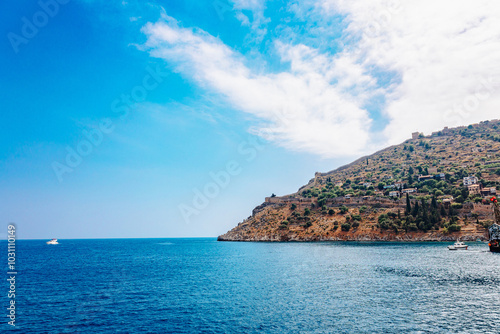 Panoramic view of blue sea and sky on Alanya coastline. Landscape view of Mediterranean coast, Alanya, Turkey. High quality photo
