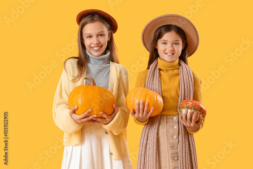 Cute girls in autumn clothe...