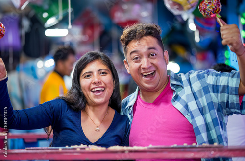 Close-up frontal shot of friends celebrating with their hands raised, they have won the lottery and are celebrating with great joy.
