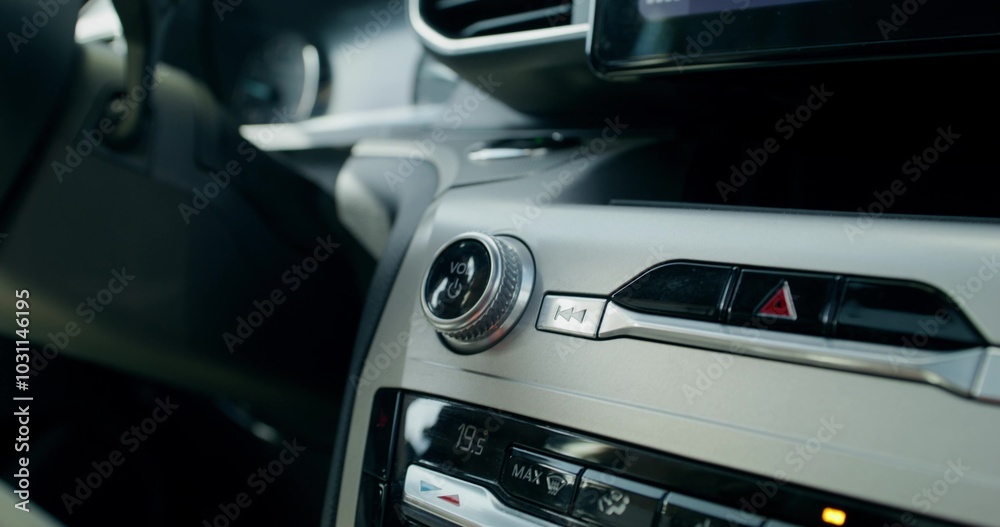 Close-up of the audio player in the car. The button for turning on and controlling the music volume. There are no people Close-up of the audio player in the car. The button for turning on and controlling the music volume. There are no people