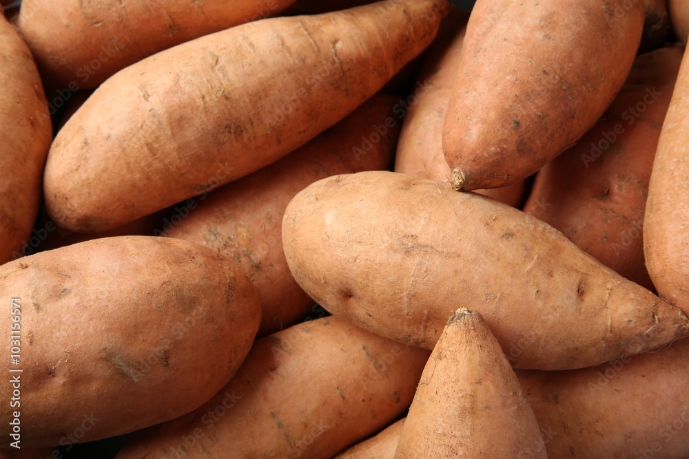 Fresh raw sweet potatoes as background, top view Fresh raw sweet potatoes as background, top view
