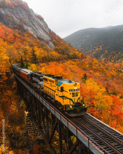 North Conway, New Hampshire - October 14, 2021: Famous Conway Train on Tracks Fall Foliage Scenic New England. Colorful Forest Trees Train Travel Tour photo