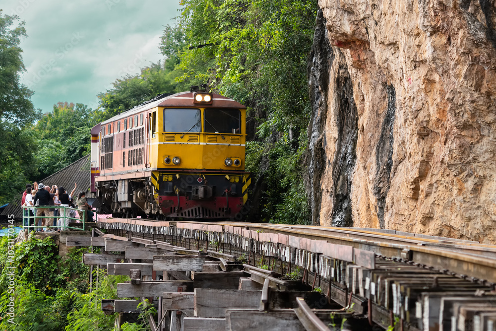 Trains running on death railways track crossing kwai river in kanchanaburi thailand this railways important destination of world war II history builted by soldier prisoners Trains running on death railways track crossing kwai river in kanchanaburi thailand this railways important destination of world war II history builted by soldier prisoners