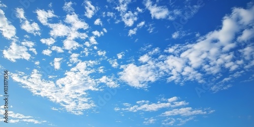 A serene day with a bright blue sky and fluffy white clouds drifting calmly overhead in a peaceful atmosphere