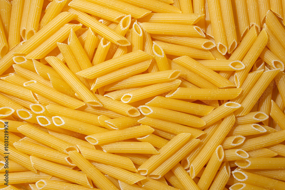 Uncooked Penne Rigate Pasta: A Culinary Canvas of Penne Macaroni, Creating a Lively and Textured Background for Gourmet Cooking. Dry Pasta. Raw Macaroni - Top View, Flat Lay Uncooked Penne Rigate Pasta: A Culinary Canvas of Penne Macaroni, Creating a Lively and Textured Background for Gourmet Cooking. Dry Pasta. Raw Macaroni - Top View, Flat Lay