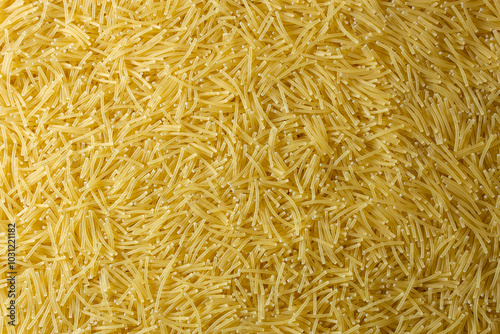 Uncooked Filini Pasta: A Culinary Canvas of Noodles, Creating a Lively and Textured Background for Gourmet Cooking. Dry Pasta. Raw Macaroni - Top View, Flat Lay photo