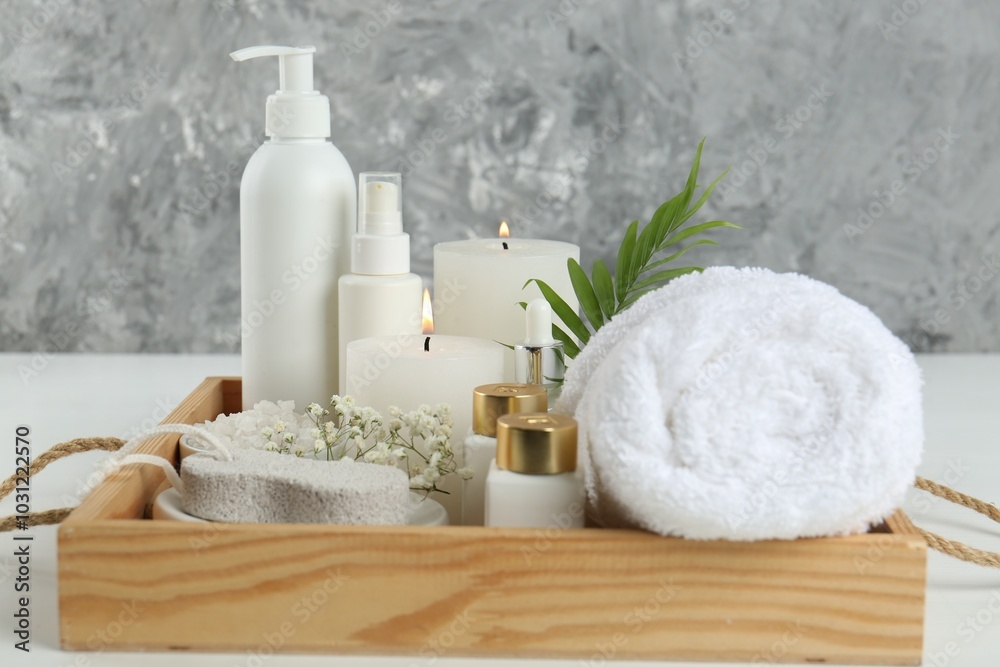 Composition with different spa supplies on white table Composition with different spa supplies on white table