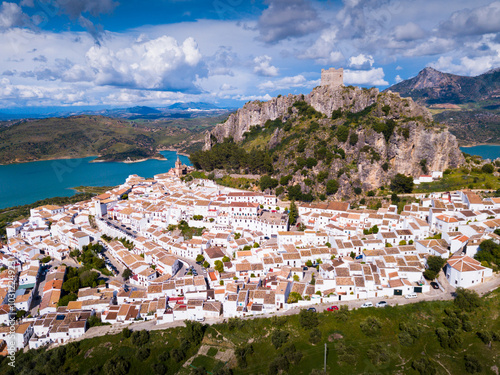 Picturesque scene of whitewashed village Zahara de la Sierra and mountain lake, Spain photo