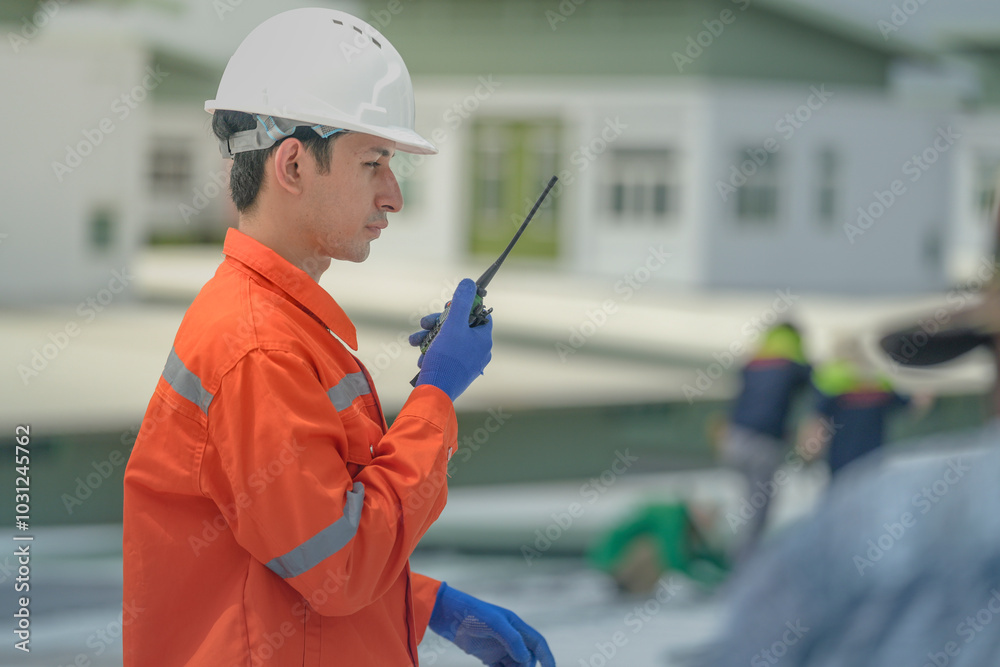 engineer man inspects construction of solar cell panel or photovoltaic cell by electronic device. Industrial Renewable energy of green power. factory worker working on tower roof. engineer man inspects construction of solar cell panel or photovoltaic cell by electronic device. Industrial Renewable energy of green power. factory worker working on tower roof.