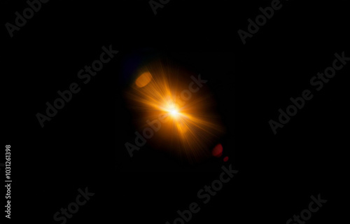 A bright golden light shines from the center of the image, radiating outward with beams of light against a black background.