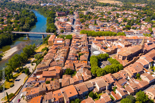 Flight over the city Muret and Garonne river on summer day. France