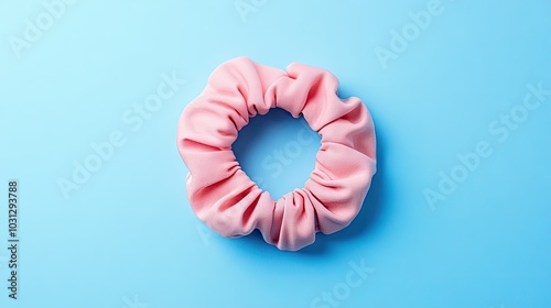 Pink Fabric Scrunchie on Blue Background