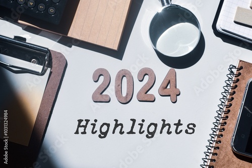 Highlights of the year 2024 concept with wooden letters and inscription. Best of the year, top events, look back, review, performance, evaluation of 2024. Office desk background. Flat lay. photo