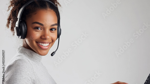 Professional young woman with headset working in a bright studio setting photo