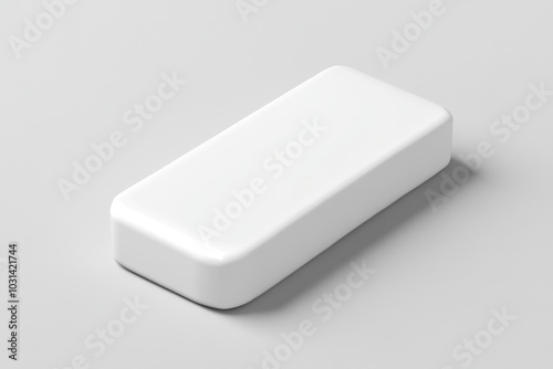 White battery case against gray background, reflecting light, minimalist design. photo