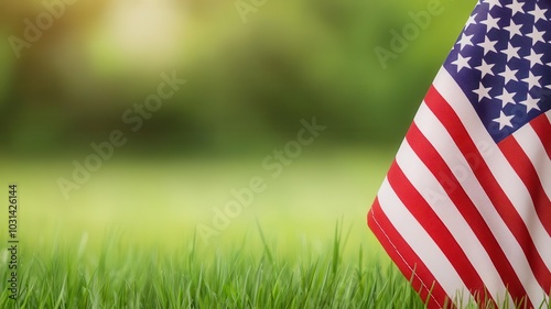 A small American flag rests on vibrant green grass, symbolizing patriotism and outdoor gatherings.