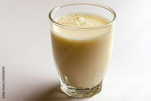 Glass of milk on white background, minimalistic composition.