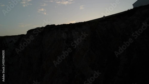 Drone shot of Bull Point Lighthouse towards the sunrise in Mortehoe, North Devon photo