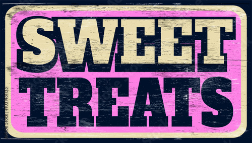 Aged and worn sweet treats sign on wood