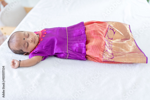 Photography ndian family spending time together, wearing traditional and casual outfits with a baby, a young girl, and grandparents in a high-rise apartment in Kuala Lumpur, Malaysia