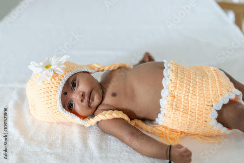 Canvas Print ndian family spending time together, wearing traditional and casual outfits with a baby, a young girl, and grandparents in a high-rise apartment in Kuala Lumpur, Malaysia