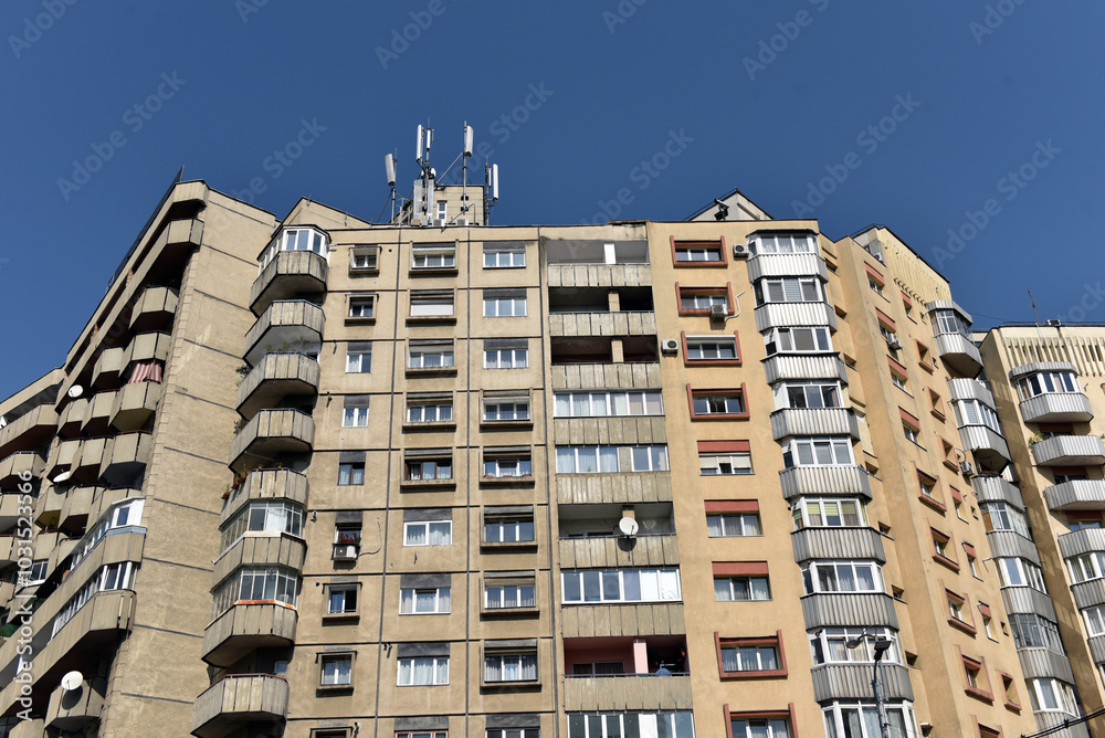 Fototapeta premium Typical facade of concrete panel building. Post Soviet flat of blocks