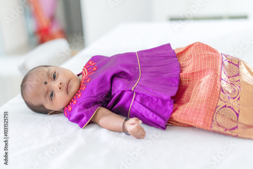 Photography ndian family spending time together, wearing traditional and casual outfits with a baby, a young girl, and grandparents in a high-rise apartment in Kuala Lumpur, Malaysia