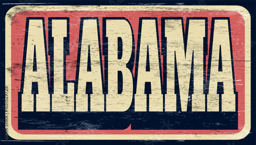 Aged and worn Alabama sign on wood