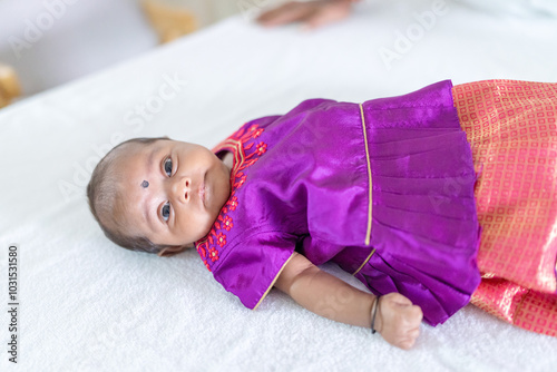Photography ndian family spending time together, wearing traditional and casual outfits with a baby, a young girl, and grandparents in a high-rise apartment in Kuala Lumpur, Malaysia