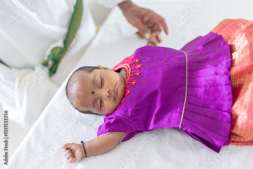 Photography ndian family spending time together, wearing traditional and casual outfits with a baby, a young girl, and grandparents in a high-rise apartment in Kuala Lumpur, Malaysia