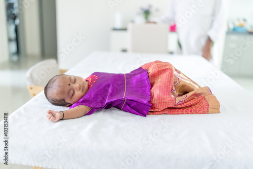 Photography ndian family spending time together, wearing traditional and casual outfits with a baby, a young girl, and grandparents in a high-rise apartment in Kuala Lumpur, Malaysia