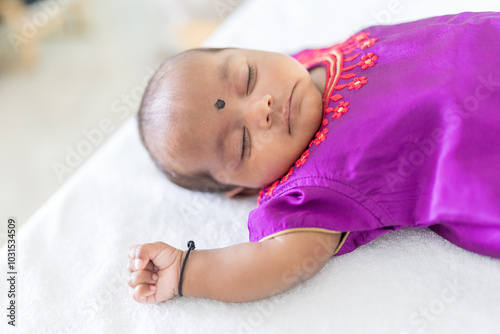Photography ndian family spending time together, wearing traditional and casual outfits with a baby, a young girl, and grandparents in a high-rise apartment in Kuala Lumpur, Malaysia