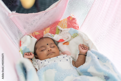 Photography ndian family spending time together, wearing traditional and casual outfits with a baby, a young girl, and grandparents in a high-rise apartment in Kuala Lumpur, Malaysia