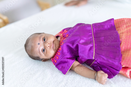 Photography ndian family spending time together, wearing traditional and casual outfits with a baby, a young girl, and grandparents in a high-rise apartment in Kuala Lumpur, Malaysia