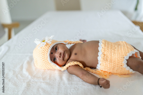 Canvas Print ndian family spending time together, wearing traditional and casual outfits with a baby, a young girl, and grandparents in a high-rise apartment in Kuala Lumpur, Malaysia