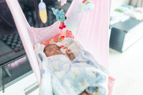 Canvas Print ndian family spending time together, wearing traditional and casual outfits with a baby, a young girl, and grandparents in a high-rise apartment in Kuala Lumpur, Malaysia