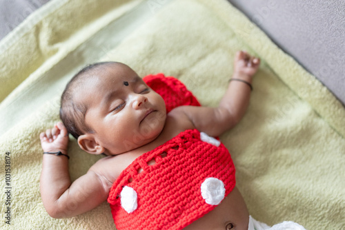 Photography ndian family spending time together, wearing traditional and casual outfits with a baby, a young girl, and grandparents in a high-rise apartment in Kuala Lumpur, Malaysia