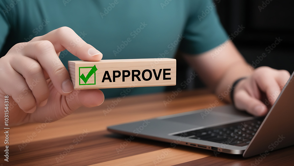 Approved. Businessman holding wooden block with text approve for document approval, assessment, approve the loan, finance agreement, loan, stamp, business. Certified Approved. Businessman holding wooden block with text approve for document approval, assessment, approve the loan, finance agreement, loan, stamp, business. Certified