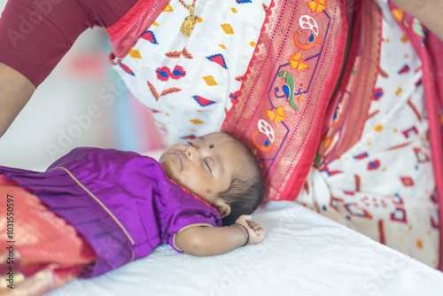 Canvas Print ndian family spending time together, wearing traditional and casual outfits with a baby, a young girl, and grandparents in a high-rise apartment in Kuala Lumpur, Malaysia