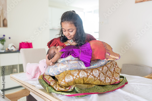 Photography ndian family spending time together, wearing traditional and casual outfits with a baby, a young girl, and grandparents in a high-rise apartment in Kuala Lumpur, Malaysia