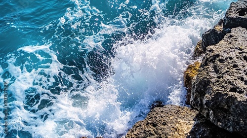 Vibrant Ocean Waves Against Rocky Shoreline