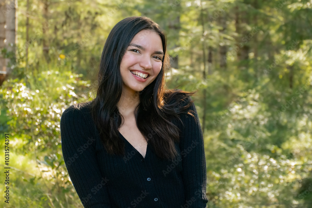 Smiling woman in a professional outdoor headshot Smiling woman in a professional outdoor headshot