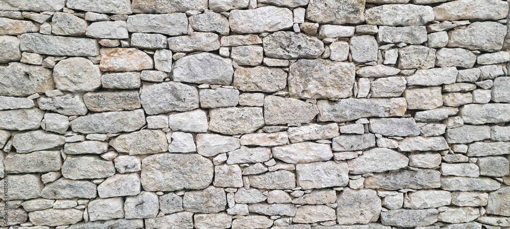 Obraz premium Stacked stone wall background