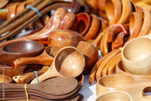 A table full of wooden spoons and ladles