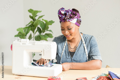 Nigerian woman sowing head wraps photo