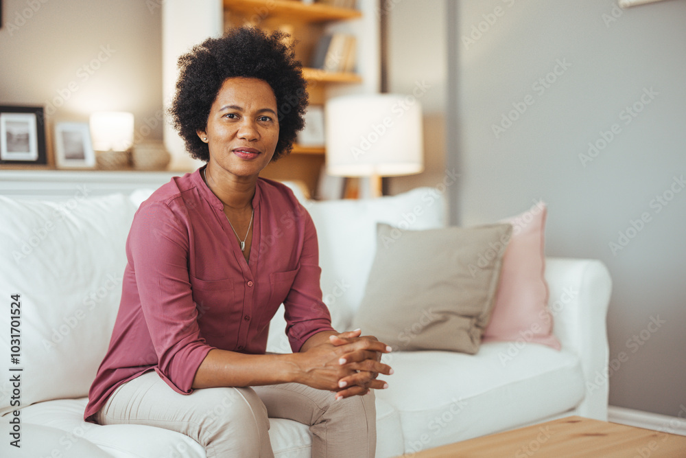 Confident Woman Relaxing on a Comfortable Sofa at Home Confident Woman Relaxing on a Comfortable Sofa at Home