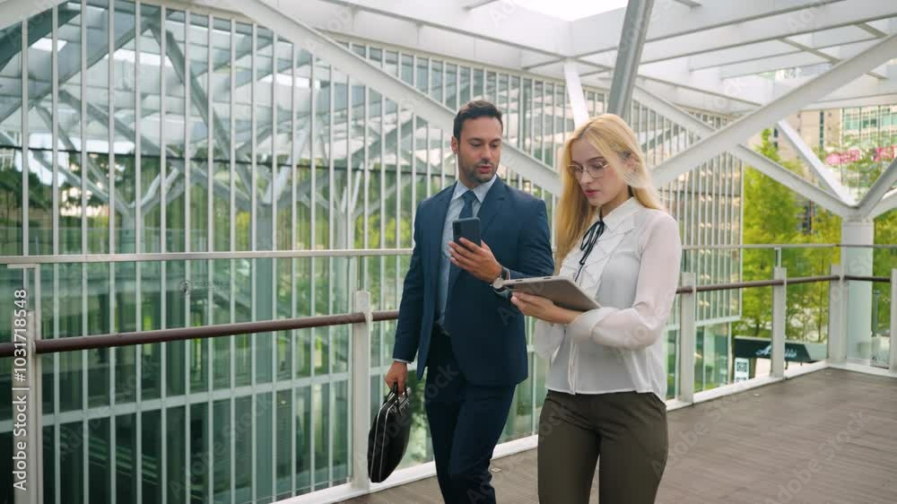 Director Talking to Secretary About Business Using Phone and Tablet on The Move Outdoors Office - Slow motion Director Talking to Secretary About Business Using Phone and Tablet on The Move Outdoors Office - Slow motion