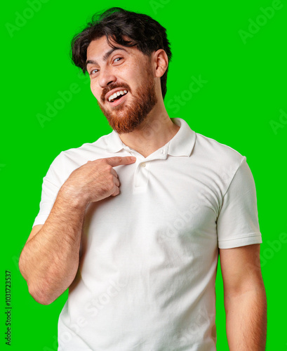 Smiling man in a white polo shirt standing confidently against a bright green background