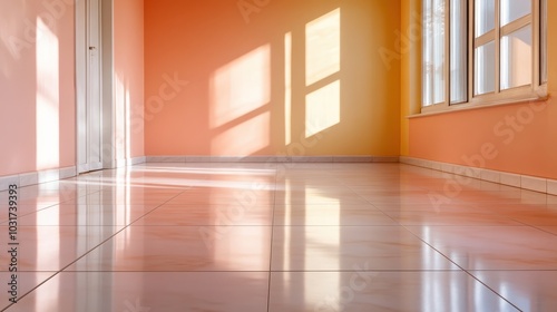 An empty room painted in warm shades of orange and yellow, with sunlight streaming through windows, creating playful patterns on the glossy tiled floor.