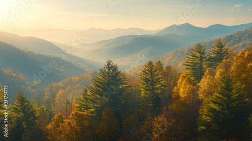 Serene autumn landscape with mountains and colorful foliage at sunrise.